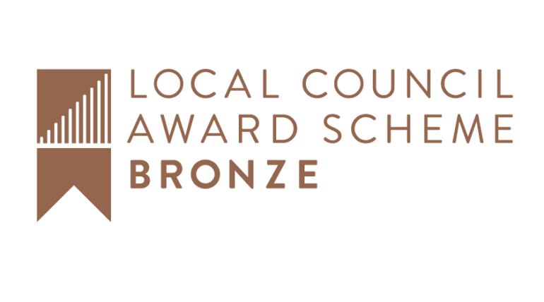 Logo for the Local Council Award Scheme in Bronze with image of ribbon on the left